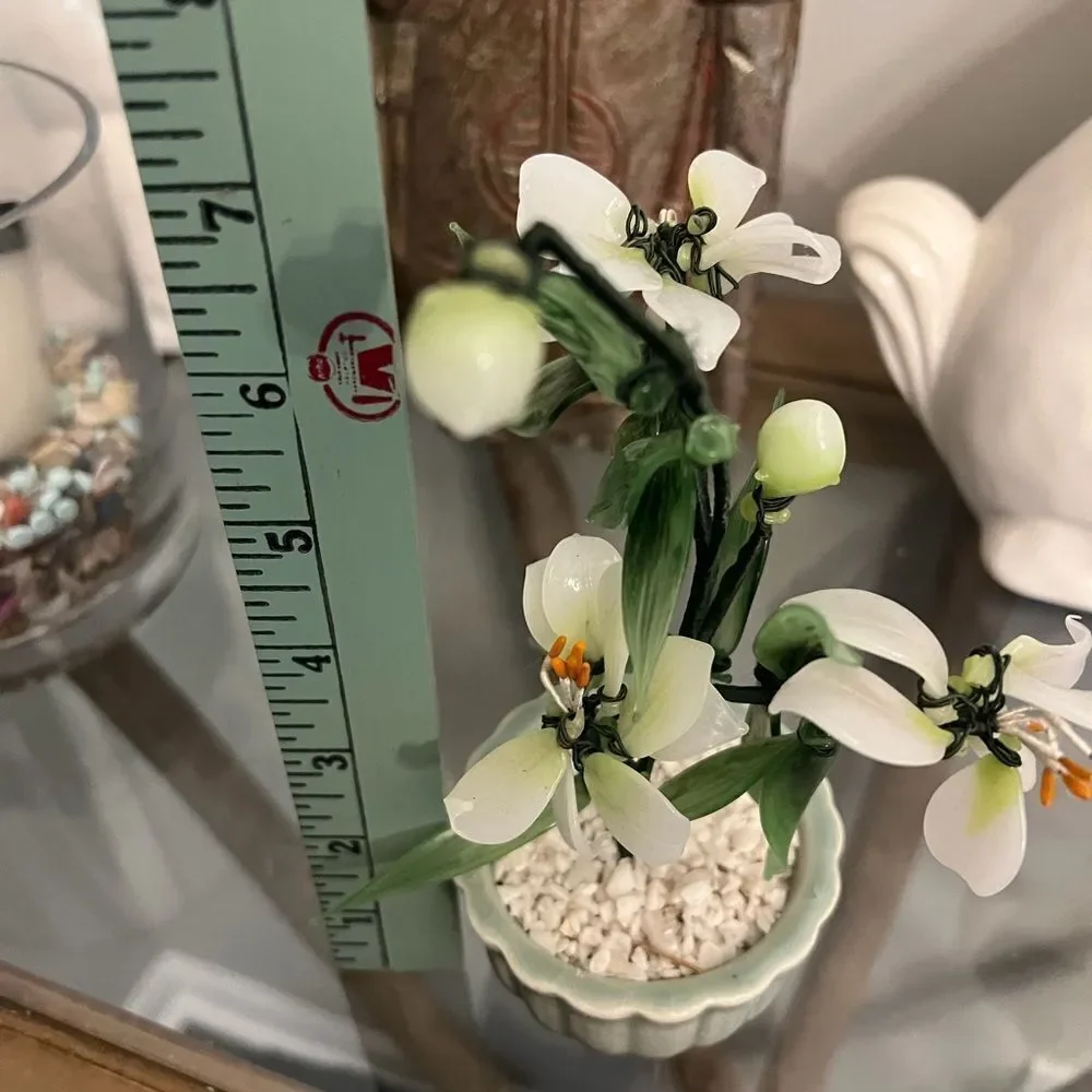Vintage jade quartz tree in celadon pot. White and Green Plant.